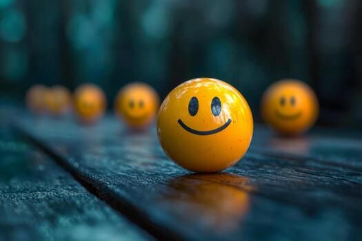 yellow-smiling-emoji-ball-on-wet-wooden-surface-with-blurred-happy-face-balls-in-background-photo.jpg